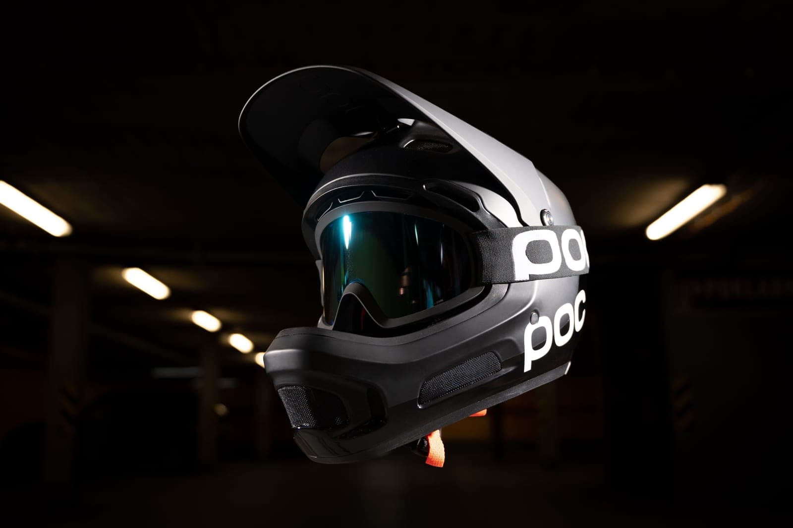 A single full-face motorcycle helmet on a dark surface